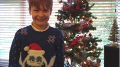 Boy in Christmas jumper.