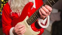 Santa playing a guitar