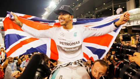 Lewis Hamilton celebrates with his team after winning the Abu Dhabi F1 Grand Prix