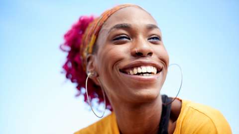 A woman smiling