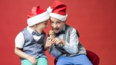 boys-santa-hats-singing-microphone.