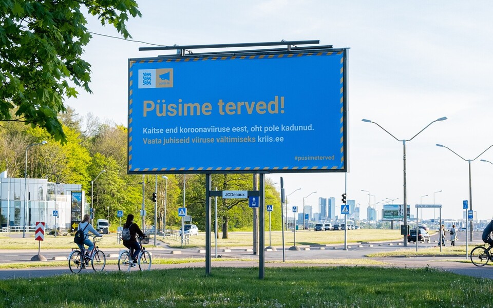 Social distancing "Stay Healthy!" sign on Tallinn's Reidi Road.