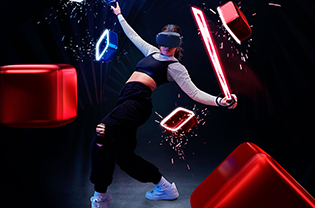 ="A woman playing Beat Saber in a dark room"