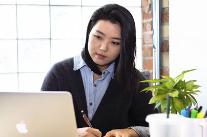 A woman working alone at her desk