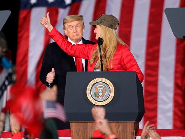 TOPSHOT - US President Donald Trump gives a thumbs up as Republican incumbent senator Kelly Loeffler speaks during a rally ahead of Senate the runoff in Dalton, Georgia on January 4, 2021. - President Donald Trump, still seeking ways to reverse his election defeat, and President-elect Joe Biden converge on …