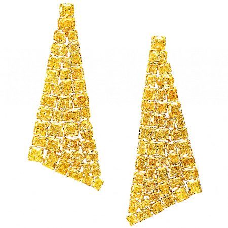 The striking, simple and contemporary silhouette of these Graff yellow diamond earrings places the stones as the heroes of the piece; their effervescent hue complemented by an almost invisible yellow gold setting